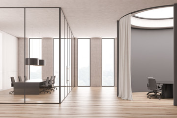 Round gray and glass wall meeting rooms