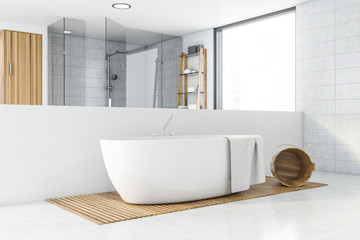 Spacious white tile bathroom corner with bathtub