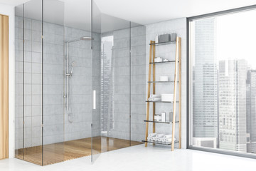 White tile bathroom corner with shower