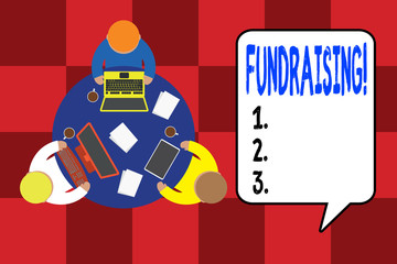 Handwriting text writing Fundraising. Conceptual photo seeking to generate financial support for charity or cause Working round table male employees electronic devices documents coffee cup