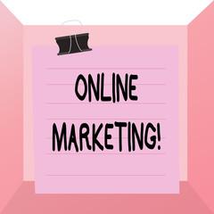 Conceptual hand writing showing Online Marketing. Concept meaning leveraging web based channels spread about companys brand Paper lines binder clip suare notebook color background