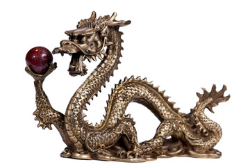 A small statue of a Chinese Dragon holding an orb