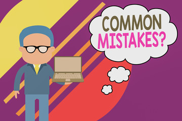 Handwriting text writing Common Mistakes question. Conceptual photo repeat act or judgement misguided or wrong Standing man in suit wearing eyeglasses holding open laptop photo Art