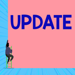 Text sign showing Update. Business photo showcasing by adding new information or making corrections Up to date Back view young man climbing up staircase ladder lying big blank rectangle