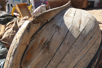 NB__8541 Wooden boat hulls or beach junk in Barreiro