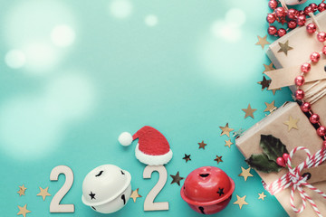 Obraz premium 2020 with Satan gift boxes with Christmas decoration on green pastel background, Festive New Year holidays background