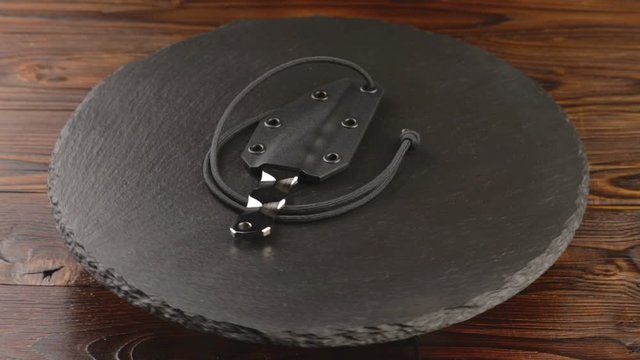 Custom hand crafted japanese kiridashi knife on the turning slate board table