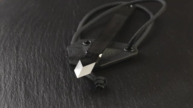 Custom hand crafted japanese kiridashi marking knife for carpenter on the turning slate board table. Polished surface