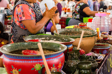 Mexican woman cooking a traditional dish