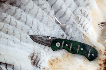 A quarts rock inlay in the green handle of this liner lock damascus pocket knife makes it a unique...
