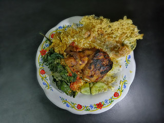 Rice, grilled chicken, peanut brittle and boiled cassava leaves