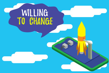 Text sign showing Willing To Change. Business photo text Desire to grow Eager and accept or adopt new ideas Ready to launch rocket lying smartphone. Startup negotiations to begin
