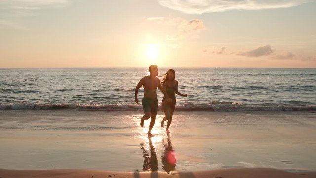 Happy young couple dating on beach ,4K