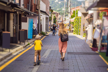 Mom and son tourists in Bukchon Hanok Village is one of the famous place for Korean traditional...