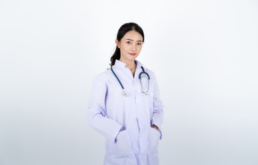 Doctor wearing white gown with a stethoscope on her neck.