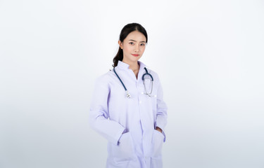 Fototapeta premium Doctor wearing white gown with a stethoscope on her neck.
