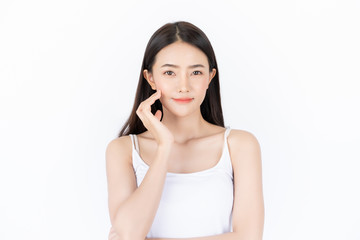Young asian woman has smiling face and bright skin tone.Asian woman standing with isolated white...