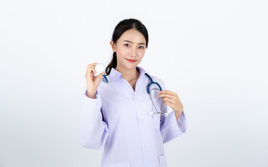 Doctor wearing white gown with a stethoscope on her neck.