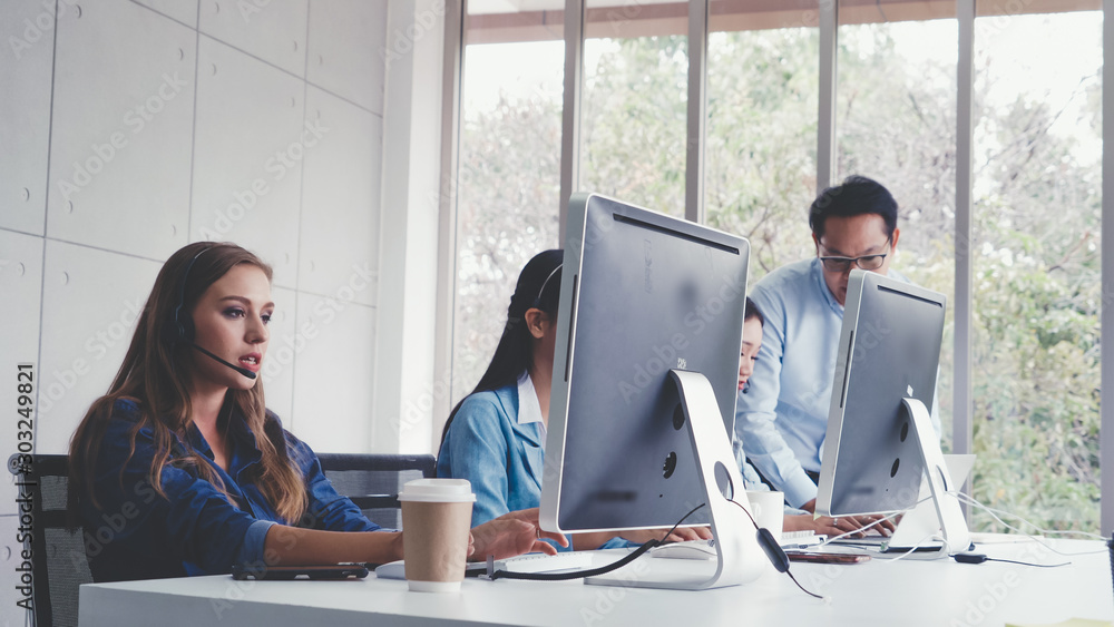 Aufkleber customer support agent or call center with headset works on desktop computer while supporting the cu