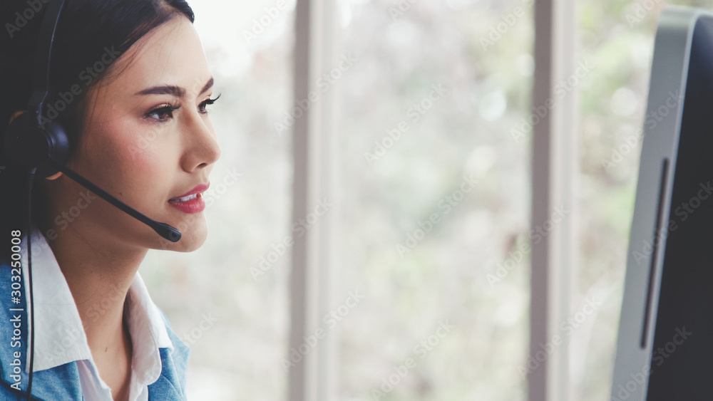 Aufkleber customer support agent or call center with headset works on desktop computer while supporting the cu