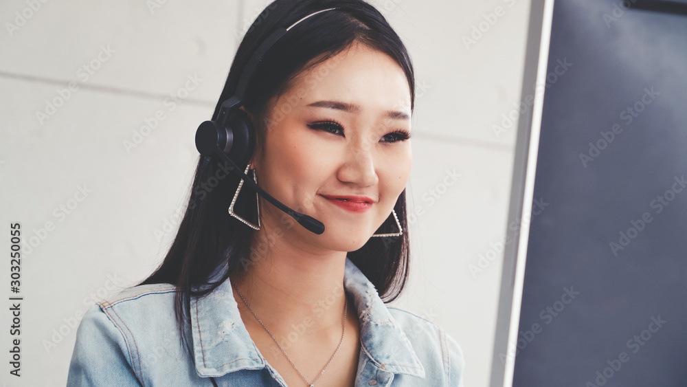 Aufkleber customer support agent or call center with headset works on desktop computer while supporting the cu