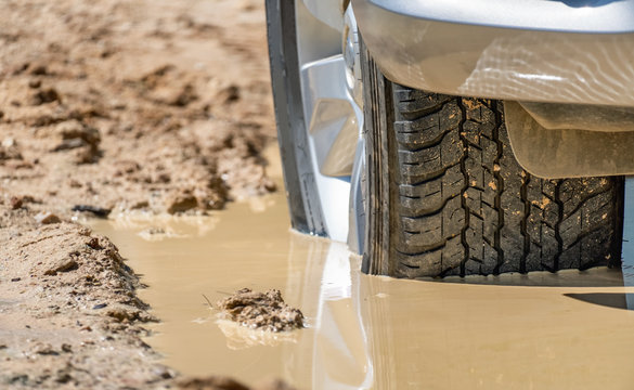 Suv 4wd Car Rides Through Deep Muddy Puddle