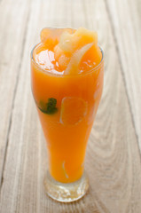Fototapeta na wymiar natural tangerine and ice smoothie