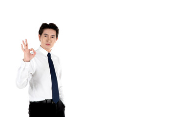 Portrait of confident man smiles, arms in pocket, okey sign fingers, isolated on white background with copy space. For motivation, finance, business, achievement and entrepreneur concept