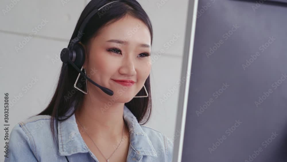 Aufkleber customer support agent or call center with headset works on desktop computer while supporting the cu