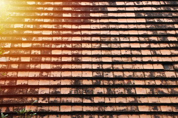 Close up Old roof tiles have black stain, dirty, have uneven surfaces Wave
