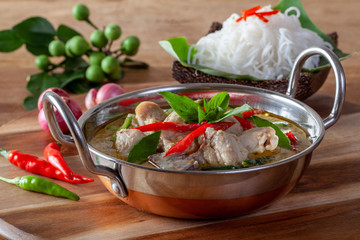 Green Curry With Chicken on wooden background ,Thai cuisine