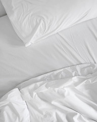 messy white bed sheets