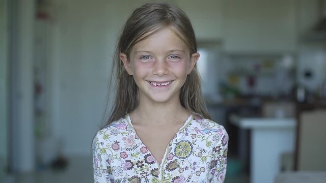 Portrait of Sweet Happy Smiling Little Girl in Slow Motion.