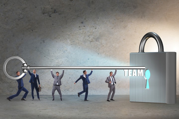 Concept of teamwork with businessmen unlocking lock