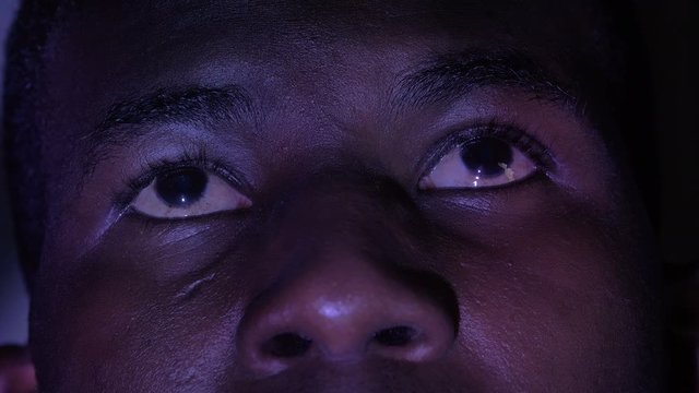 Drunk stoned young american african man's eyes- macro