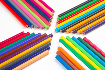 Fototapeta premium Colored pencils for drawing on a white background. Education and creativity. Leisure and art