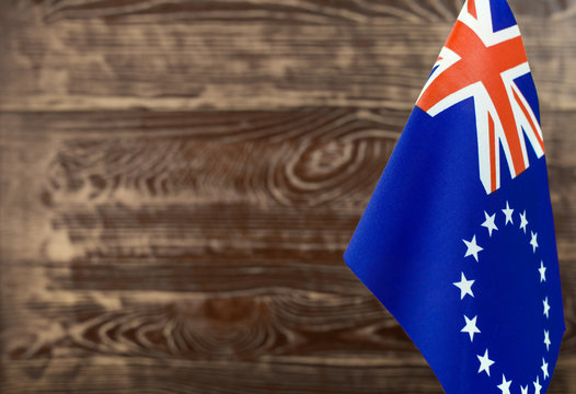 Fragment Of The Flag Of The Cook Islands In The Foreground Blurred Background Copy Space