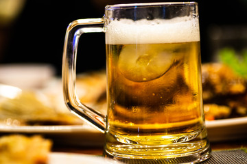 Background Cool beers with beer bubbles on top a glass at the party