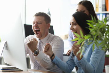 Cute colleagues holding fists