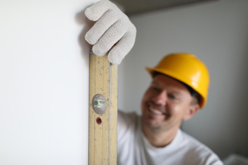 Worker with measuring ruler