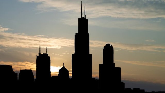 Chicago: Downtown Skyline with Skyscrapers in Silhouette, Time Lapse at Sunrise with Colorful Clouds, Illinois, USA