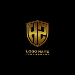 Initial letters HZ shield shape gold monogram logo. Shield Secure Safe logo design inspiration