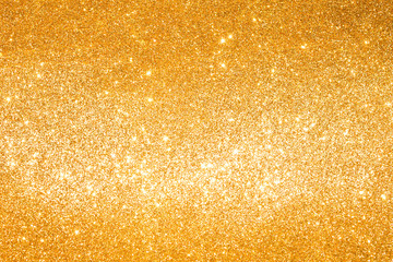 sparkles of golden glitter abstract background	
