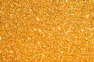 sparkles of golden glitter abstract background	