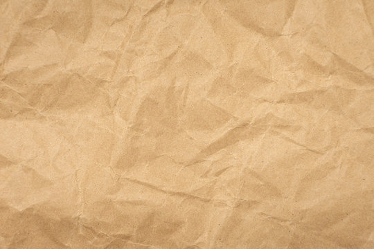 Crumpled brown paper texture vintage background.