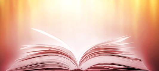 Book in library with old open textbook, stack piles of literature text archive on reading desk, and aisle of bookshelves in school study class room background for academic education learning concept