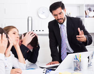 Irritated boss scolding subordinates