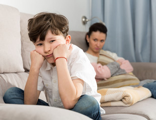 Fototapeta premium Offended tweenager after disagreements with mom