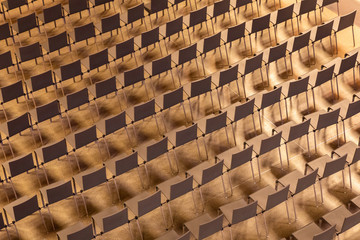 Plain chairs arranging in pattern of line and row