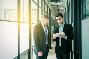 Businessmen with tablet computer